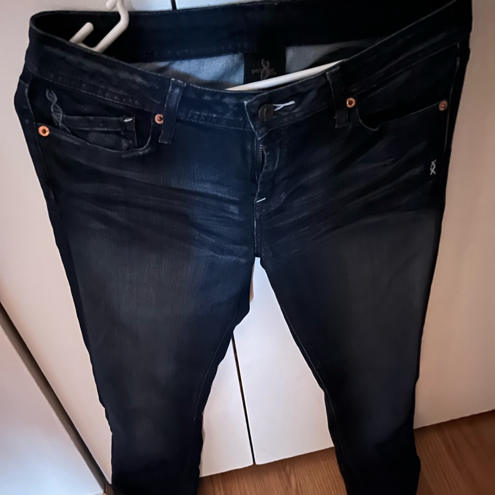 Designer jeans: Dark wash with fading details. Excellent condition